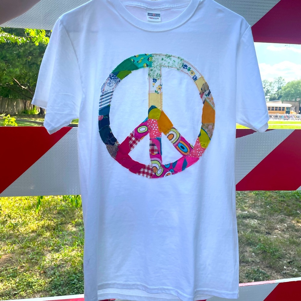 Hand stitched & sewn on peace sign using vintage and retro fabric